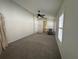 Large bedroom with carpeted floors, ceiling fan, and ample natural light at 10955 Lemay Dr, Clermont, FL 34711