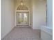 Stylish double front doors with decorative glass, covered entrance, and overhead lighting at 10955 Lemay Dr, Clermont, FL 34711