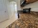 Kitchen featuring black stove-top range, granite countertops, and tile floors at 10955 Lemay Dr, Clermont, FL 34711