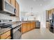 Spacious kitchen with stainless steel appliances and granite countertops at 10955 Lemay Dr, Clermont, FL 34711