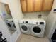 Laundry room featuring modern washer and dryer at 10955 Lemay Dr, Clermont, FL 34711