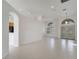 Open living room features recessed lighting, tile flooring and front door at 10955 Lemay Dr, Clermont, FL 34711