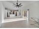Open-concept living area with tile floors, vaulted ceilings and plenty of natural light at 10955 Lemay Dr, Clermont, FL 34711