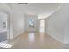 Bright living room with tile flooring, recessed lights, and arched window at 10955 Lemay Dr, Clermont, FL 34711
