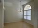 Open-concept living area with tile flooring, chandelier, and plenty of natural light at 10955 Lemay Dr, Clermont, FL 34711