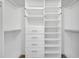 Organized walk-in closet features built-in shelving and drawers at 10955 Lemay Dr, Clermont, FL 34711