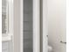 Bathroom closet with white shelving for organization and storage solutions at 1257 Champions Dr, Daytona Beach, FL 32124