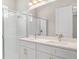 Bathroom features a double sink vanity with a glass-enclosed shower at 1257 Champions Dr, Daytona Beach, FL 32124