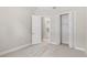 Open bedroom with closet and neutral decor at 1257 Champions Dr, Daytona Beach, FL 32124