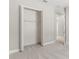 A bedroom closet with bi-fold doors and metal shelving provides ample storage space at 1257 Champions Dr, Daytona Beach, FL 32124
