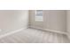 Empty bedroom with carpet, white trim and neutral walls at 1257 Champions Dr, Daytona Beach, FL 32124