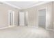 Bedroom view showcasing neutral decor, carpet flooring, and closet at 1257 Champions Dr, Daytona Beach, FL 32124