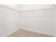 Walk-in closet with carpeted floor and wire shelving system at 1257 Champions Dr, Daytona Beach, FL 32124