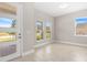 Spacious entryway featuring tile floors, front door with glass panels, and an abundance of natural light at 1257 Champions Dr, Daytona Beach, FL 32124