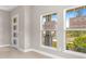 Sunlit entryway boasts tile flooring, trim and views of the landscaped front yard at 1257 Champions Dr, Daytona Beach, FL 32124