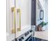 Elegant kitchen cabinets with modern gold hardware and trim, showcasing a blend of style and functionality at 1257 Champions Dr, Daytona Beach, FL 32124