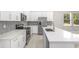 Well-appointed kitchen with stainless steel appliances, quartz countertops, and stylish backsplash at 1257 Champions Dr, Daytona Beach, FL 32124