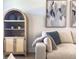 Stylish living area with comfortable seating, shelving, and tasteful decorations creating a welcoming space at 1257 Champions Dr, Daytona Beach, FL 32124