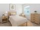 Neutral bedroom offers calm and relaxation with a comfortable bed, side tables, and soft lighting at 1267 Berry Ln, Davenport, FL 33837