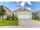 Charming single-story home featuring a two-car garage and well-maintained landscaping with a classic design at 1267 Berry Ln, Davenport, FL 33837