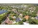 Panoramic aerial shot showcasing neighborhood with lake views, lush greenery and well manicured lawns at 1327 Bridgeport Dr, Winter Park, FL 32789