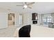Bright bedroom with a cozy fireplace and a large walk-in closet, providing both comfort and ample storage space at 1327 Bridgeport Dr, Winter Park, FL 32789