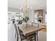 Open-concept dining room, seamlessly connected to a cozy living room and a bright kitchen with modern amenities at 1327 Bridgeport Dr, Winter Park, FL 32789
