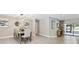 Open-concept dining area with stylish decor, modern lighting, and seamless transition to outdoor living space at 1327 Bridgeport Dr, Winter Park, FL 32789