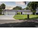 Charming single-story home with well-manicured lawn and inviting curb appeal at 1327 Bridgeport Dr, Winter Park, FL 32789