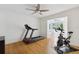 Home gym includes a ceiling fan and natural light and open access to an office at 1327 Bridgeport Dr, Winter Park, FL 32789