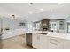 Modern kitchen boasts stainless appliances, white cabinets, and an open floor plan at 1327 Bridgeport Dr, Winter Park, FL 32789