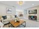 Inviting living room showcases an open floor plan with a seamless transition into the dining area at 1327 Bridgeport Dr, Winter Park, FL 32789