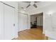 Open concept office featuring wood floors and access to an adjacent home gym at 1327 Bridgeport Dr, Winter Park, FL 32789