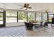 Inviting screened patio with comfortable seating and serene views of the pool and backyard at 1327 Bridgeport Dr, Winter Park, FL 32789