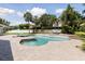 Inviting freeform pool area, surrounded by lush landscaping and serene privacy at 1327 Bridgeport Dr, Winter Park, FL 32789