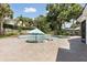 Inviting backyard pool with surrounding brick patio and lush landscaping at 1327 Bridgeport Dr, Winter Park, FL 32789