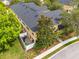 Aerial view showcasing the layout of townhomes with patios and the surrounding green spaces at 14025 Oasis Springs Ln # 901, Windermere, FL 34786