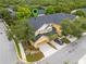 Aerial view of a beautifully landscaped two-story home with a garage and well-maintained surroundings at 14025 Oasis Springs Ln # 901, Windermere, FL 34786