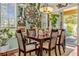 Elegant dining room featuring a large dining table, stylish decor, and natural light at 14025 Oasis Springs Ln # 901, Windermere, FL 34786