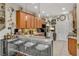 Stylish kitchen featuring stainless steel appliances, bar seating, and custom backsplash at 14025 Oasis Springs Ln # 901, Windermere, FL 34786