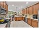 Open-concept kitchen featuring stainless steel appliances and a breakfast bar, great for entertaining at 14025 Oasis Springs Ln # 901, Windermere, FL 34786