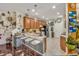 Stylish kitchen featuring stainless steel appliances, bar seating, and custom backsplash at 14025 Oasis Springs Ln # 901, Windermere, FL 34786