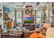 Bright living room boasting eclectic decor, hardwood floors, and tons of natural light at 14025 Oasis Springs Ln # 901, Windermere, FL 34786