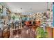 Bright, open living room area with sleek, dark floors and unique eclectic decor and furnishings at 14025 Oasis Springs Ln # 901, Windermere, FL 34786