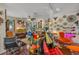 Cozy living room features unique decor, hardwood floors, and a comfortable seating arrangement at 14025 Oasis Springs Ln # 901, Windermere, FL 34786