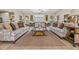 Comfortable lounge showcasing stylish sofas, decorative rugs, and elegant furnishings for a refined social space at 14025 Oasis Springs Ln # 901, Windermere, FL 34786