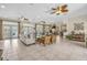 Spacious lounge area with tile flooring, ceiling fans, and comfortable seating, perfect for relaxation and social gatherings at 14025 Oasis Springs Ln # 901, Windermere, FL 34786