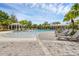 Resort-style pool area surrounded by seating, lush landscaping, perfect for relaxation and recreation at 14025 Oasis Springs Ln # 901, Windermere, FL 34786