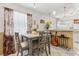 Cozy dining area with a modern table, comfortable seating, and open access to the kitchen at 1432 Selma Ave, Orlando, FL 32825