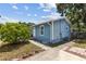 The home features a well-maintained exterior with mature trees and a paved walkway at 1432 Selma Ave, Orlando, FL 32825